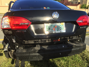  The bumper of a University of Miami student's car hangs after an accident. (Photo courtesy of Sidney Sterling)