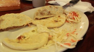 Two types of pupusas from El Atlakat, one with beans cheese and pork belly and the other with cheese and lorroco, served with pickled cabbage and and carrot salad.