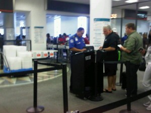 Passengers get boarding pass, identification checked at Miami International Airport (Photo by Brandon Lumish).