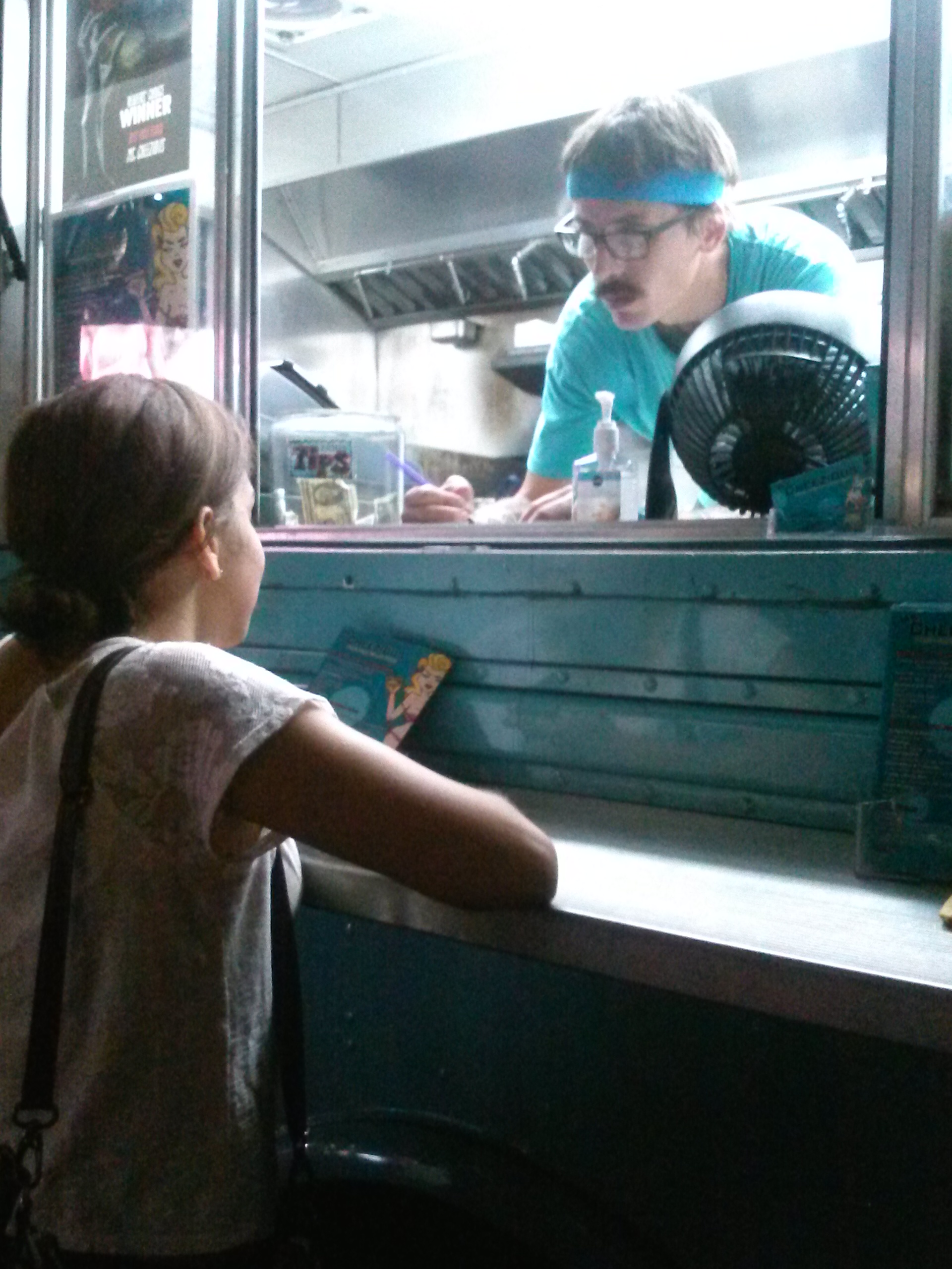 The author's sister Vicky takes her order of a plain grilled cheese sandwich from Ms. Cheezious food truck at the Seminole Hard Rock and Casino (Photo by Daniela Rodriguez).
